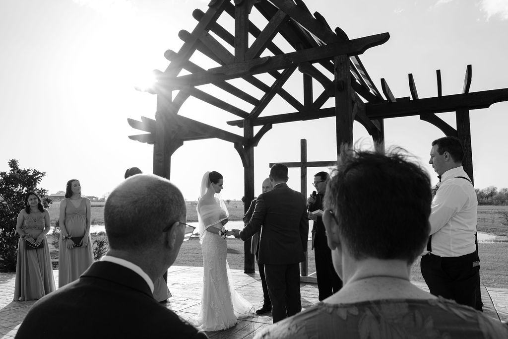 Intimate countryside event venue, cross and water backdrop