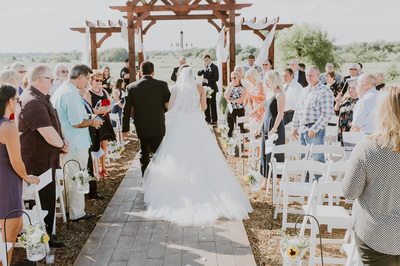 wedding ceremony, outdoor with trees and waterfront