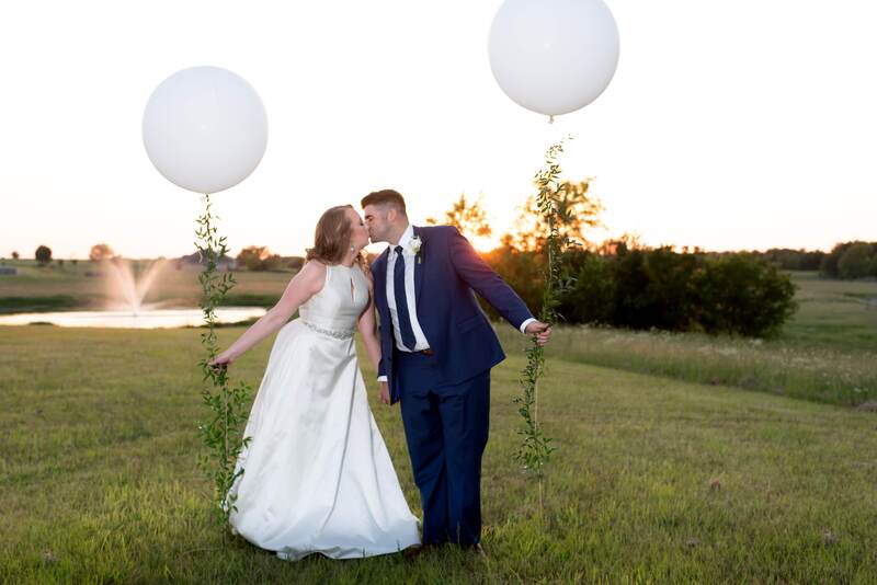 engagement party celebration event venue with white balloons and greenery north texas