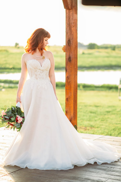 bride outdoor under arbor, stunning dress