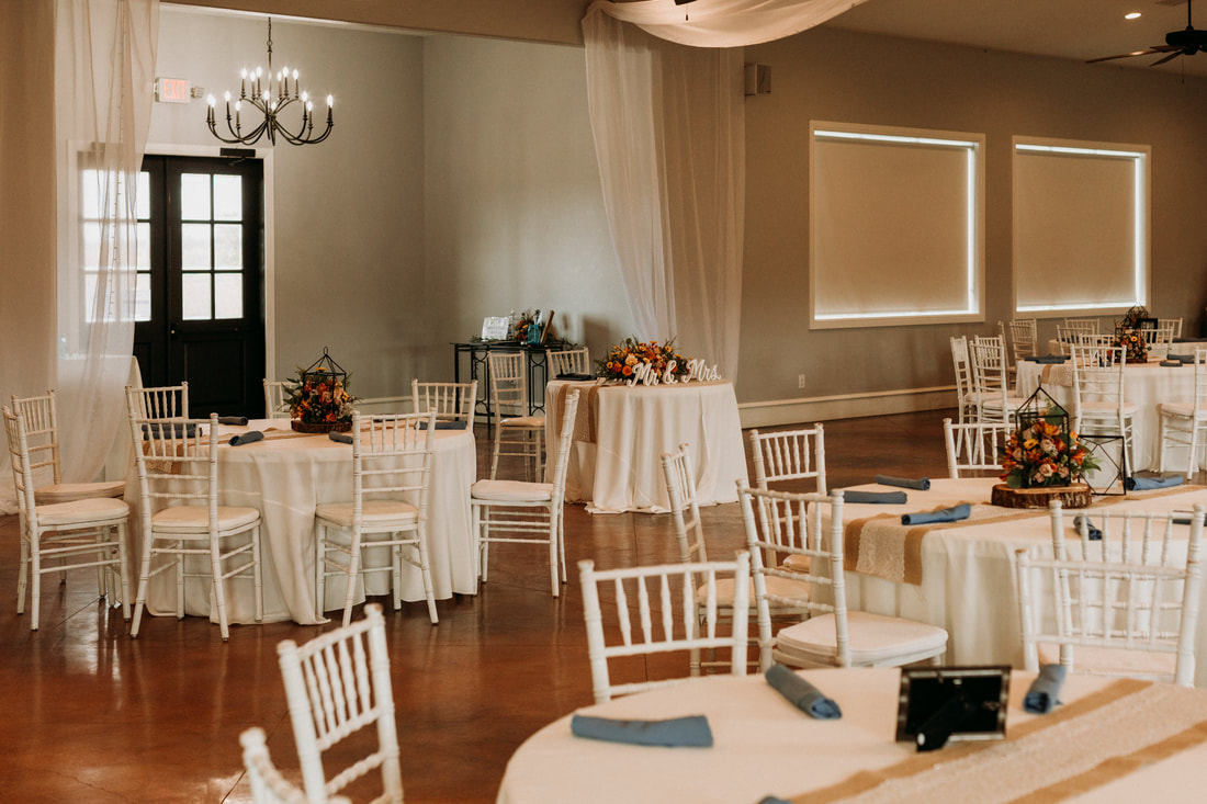 Indoor reception venue near Denton, rustic fall style with chandelier and outdoor area